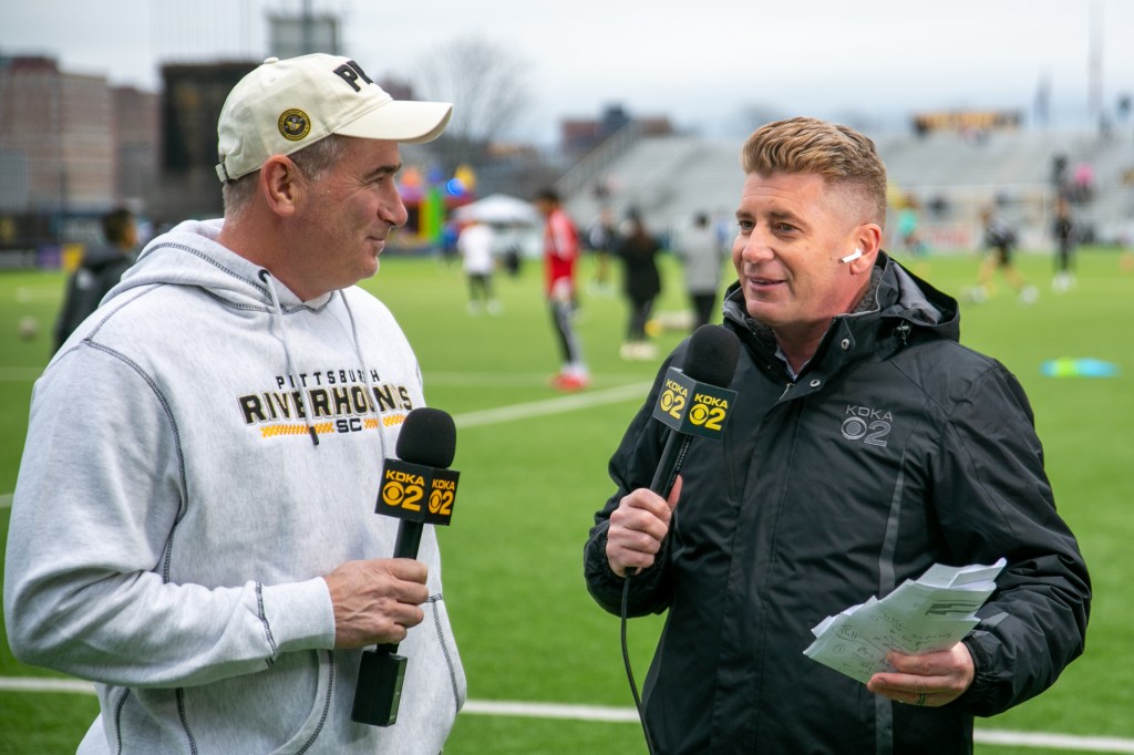 Hounds owner Tuffy Shallenberger (left) joins KDKA sports anchor Rich Walsh for a live shot during pregame warm-ups for the home opener against Miami FC, Friday, March 24 at Highmark Stadium.