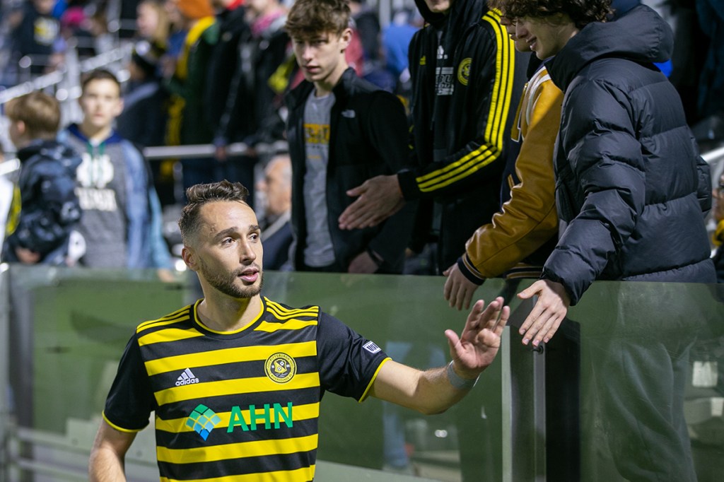 Joe Farrell shakes hands with fans after the Pittsburgh Riverhounds' 1-1 draw with Miami FC in their home opener, Friday, March 24 at Highmark Stadium.