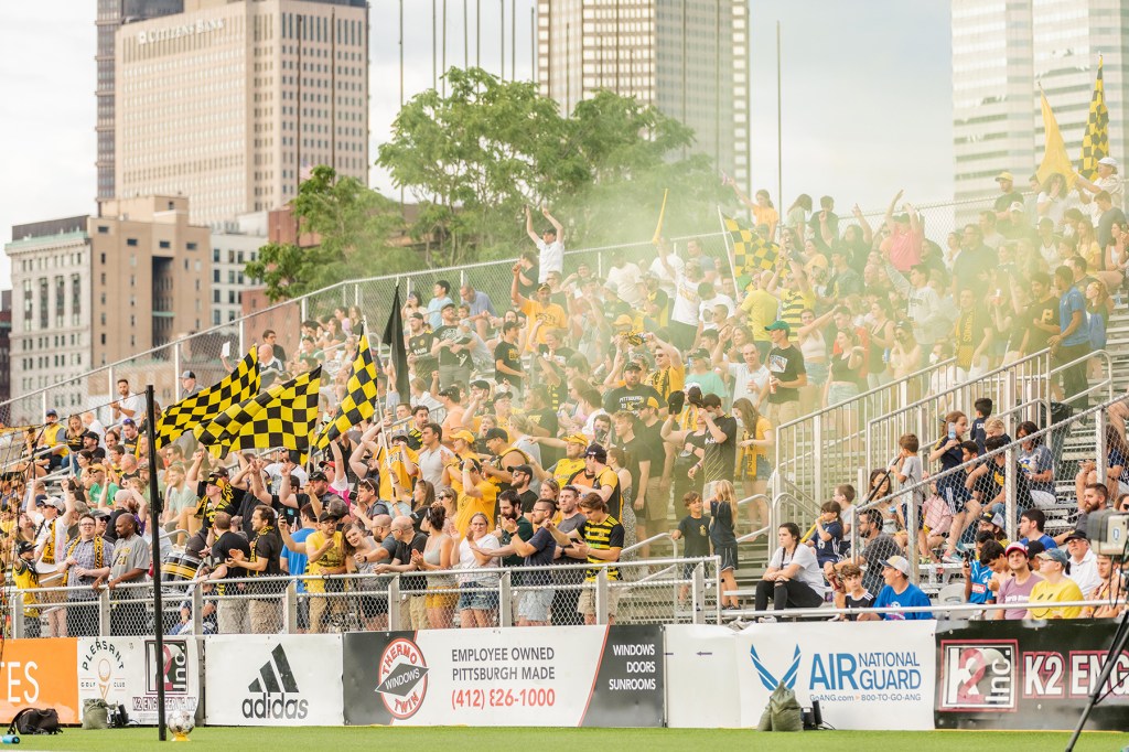 Fans celebrate in the Paul Child Stand after a goal in the Riverhounds' 4-1 win over Miami FC on July 9, 2022, at Highmark Stadium.