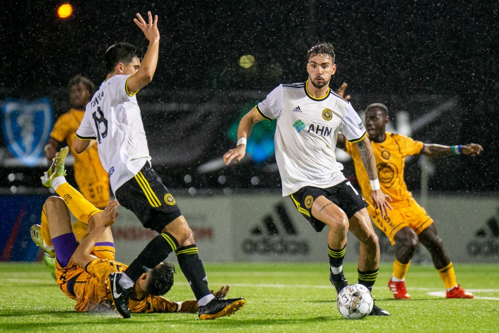 Arturo Ordóñez dribbles the ball away from a tackle in the Riverhounds' 2-0 win over the Maryland Bobcats in the 2022 U.S. Open Cup Second Round at Highmark Stadium.