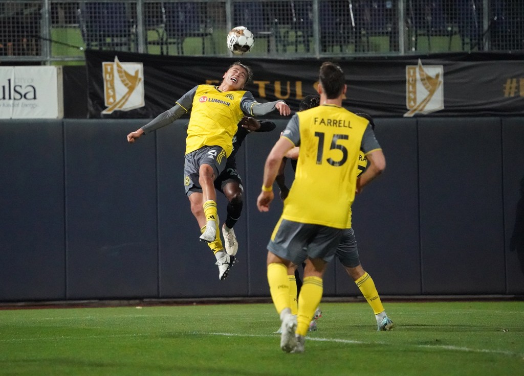 Nate Dossantos heads a ball for the Riverhounds in their 0-0 draw at FC Tulsa.