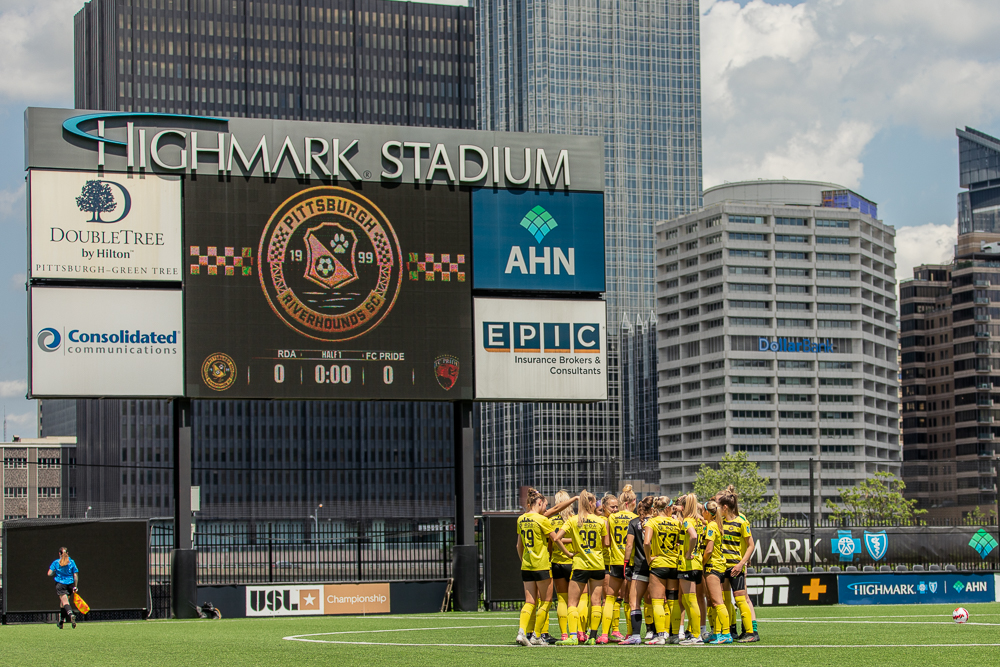 The Riverhounds Development Academy Girls huddle up before an ECNL match at Highmark Stadium.