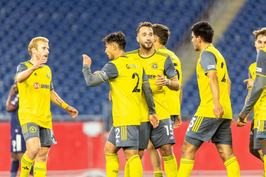 Riverhounds players celebrate Danny Griffin's goal in the team's 1-0 U.S. Open Cup win over the New England Revolution at Gillette Stadium in Foxborough, Mass. on May 9, 2023.