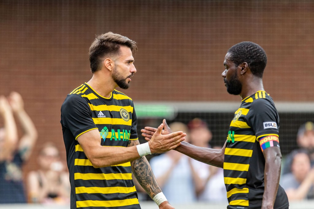 Arturo Ordóñez celebrates his goal against Phoenix with Kenardo Forbes in the Riverhounds' 1-0 win at Highmark Stadium on June 3, 2023.