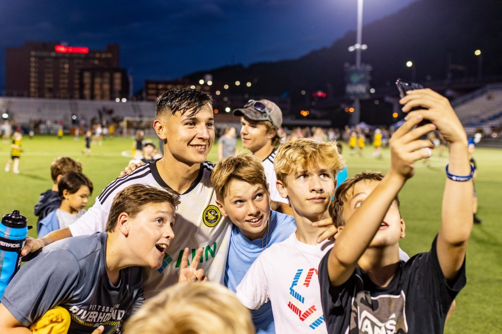 
Danny Griffin smiles for a photo with young fans after the Riverhounds' 2-1 win over San Diego Loyal SC on June 24 at Highmark Stadium.