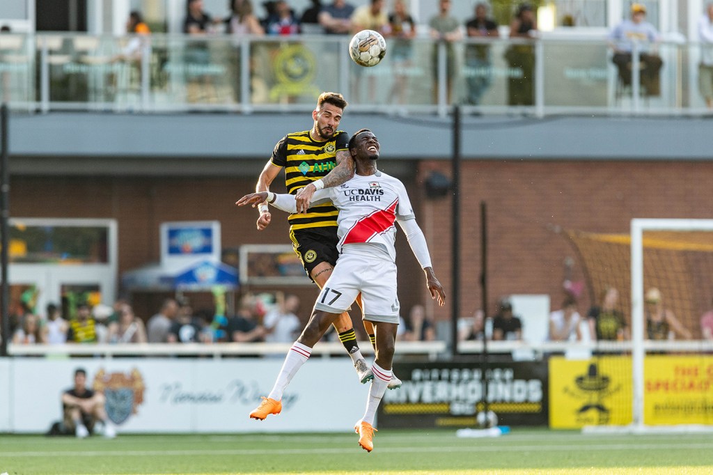 The Riverhounds' Arturo Ordonez rises over Sacramento Republic's Luther Archimede to win a header during the match July 8, 2023 at Highmark Stadium.