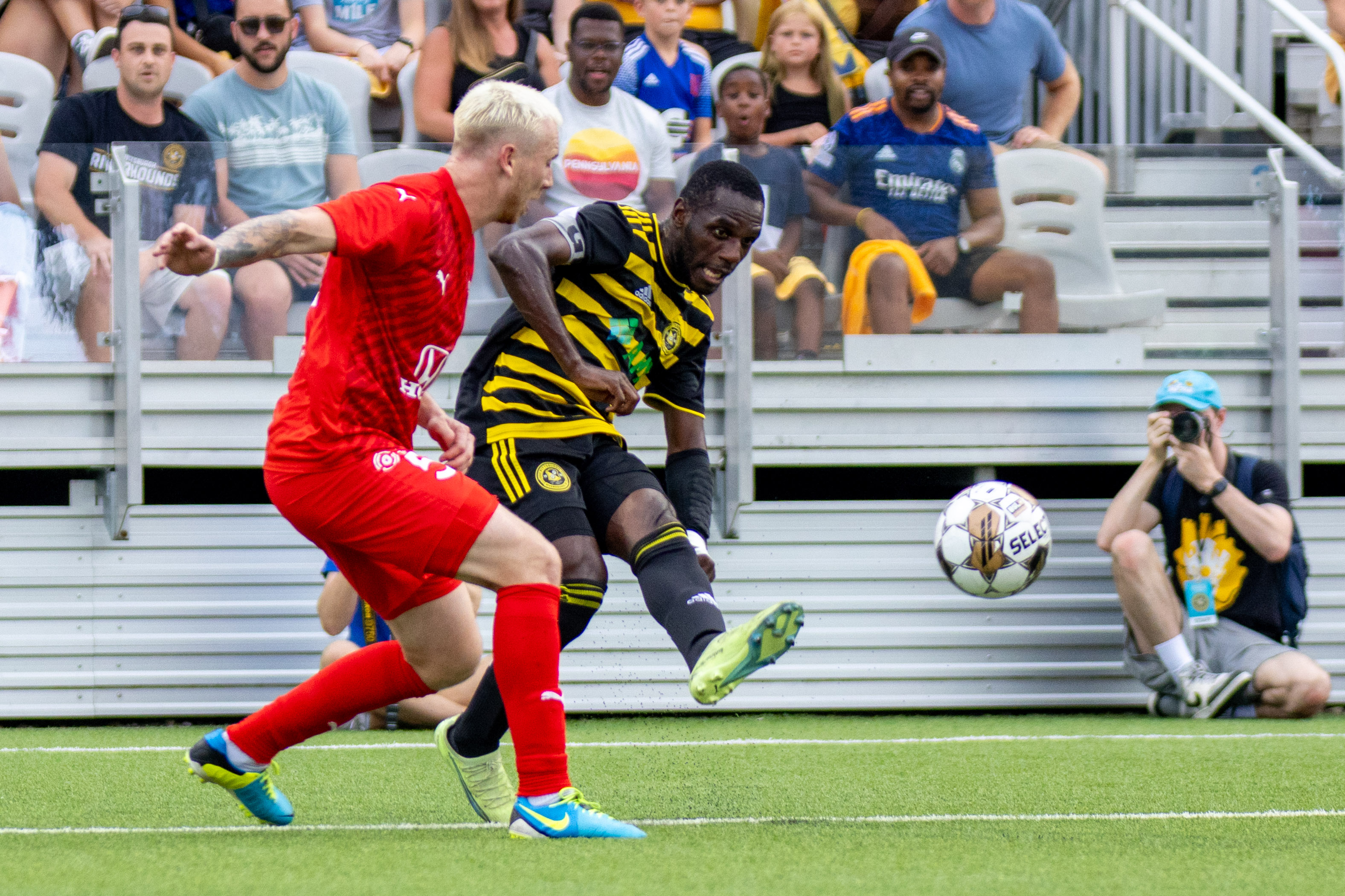 Junior Etou plays a pass during the Riverhounds match against Indy Eleven on July 26, 2023 at Highmark Stadium.