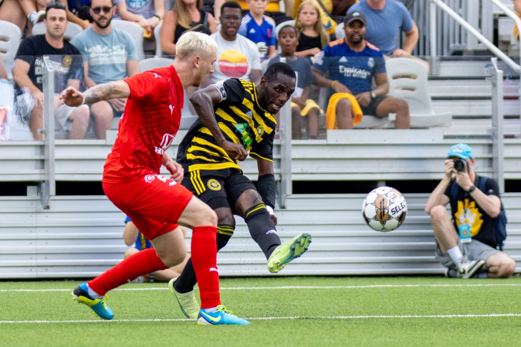 Junior Etou plays a pass during the Riverhounds match against Indy Eleven on July 26, 2023 at Highmark Stadium.