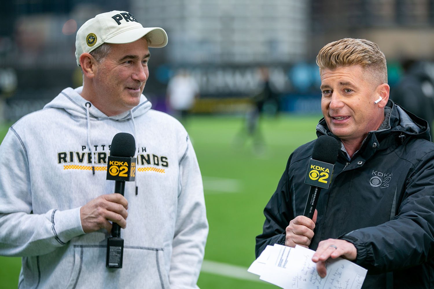 Riverhounds owner Tuffy Shallenberger speaks on the field with KDKA-TV sports anchor Rich Walsh before the 2023 season opener at Highmark Stadium.