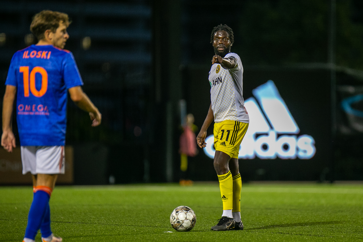 Kenardo Forbes points as Orange County's Milan Iloski positions himself to defend a free kick in the Riverhounds' 1-1 draw on Sept. 24, 2022 at Highmark Stadium.
