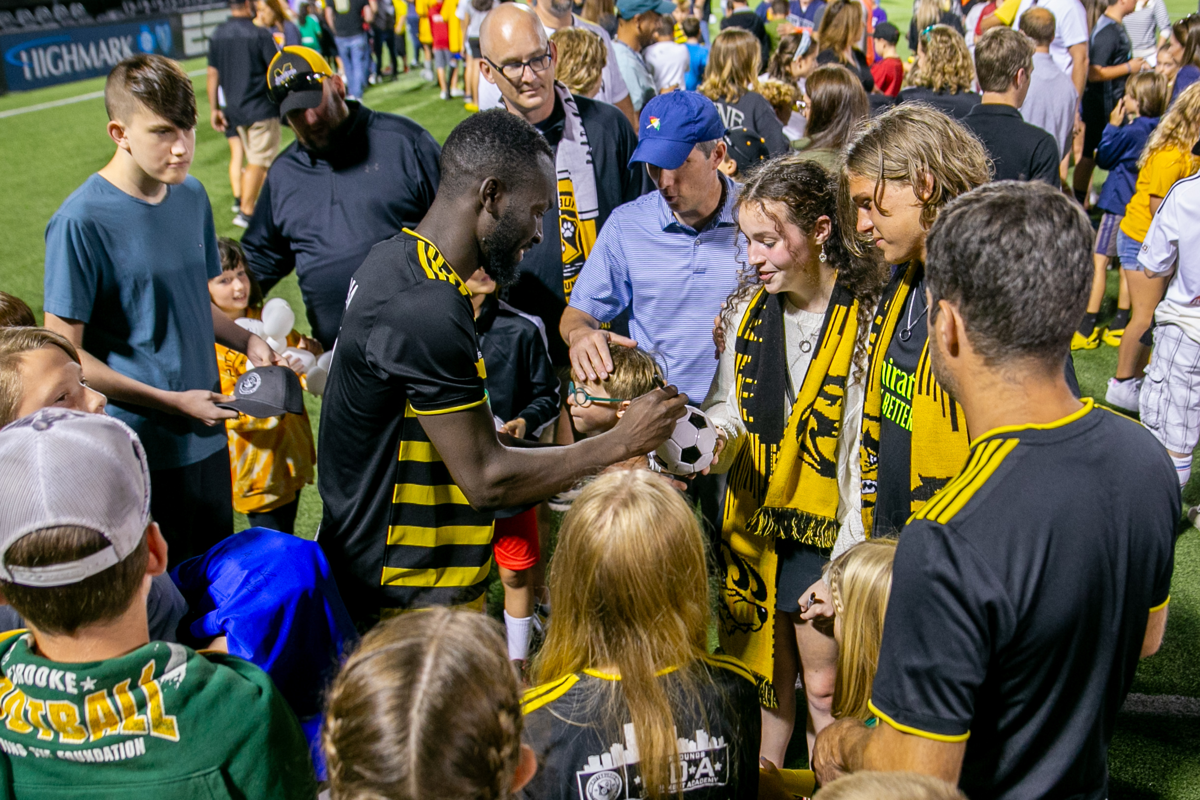 Albert Dikwa signs autographs on the field after the Riverhounds' 3-1 win over Loudoun United FC on Sept. 9, 2023 at Highmark Stadium.