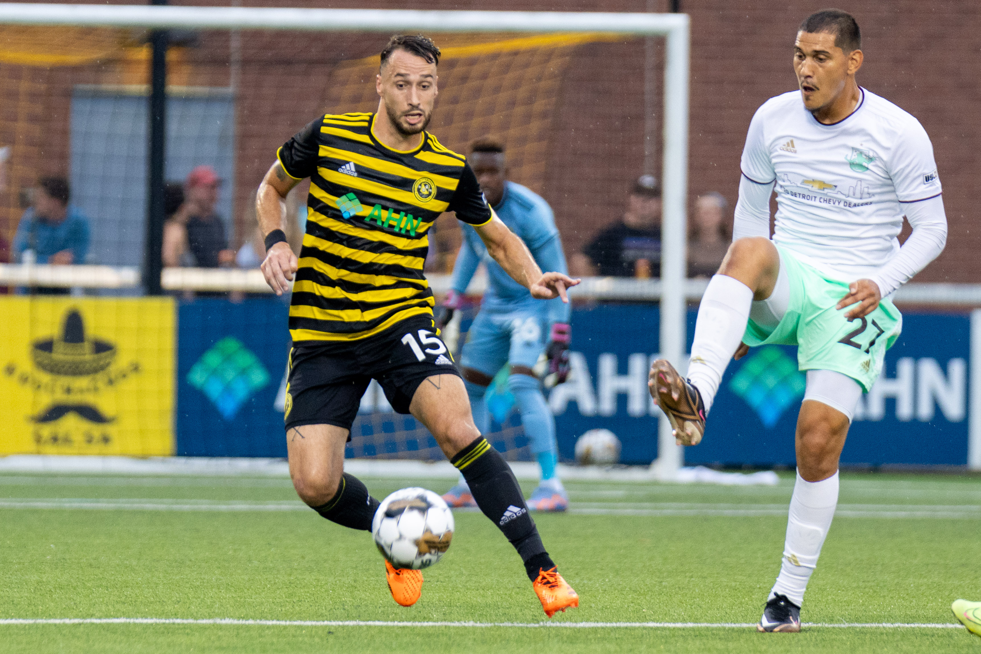 Riverhounds defender Joe Farrell dribbles away from Detroit City FC's Yazeed Matthews during the Hounds' 2-0 win July 15, 2023 at Highmark Stadium.