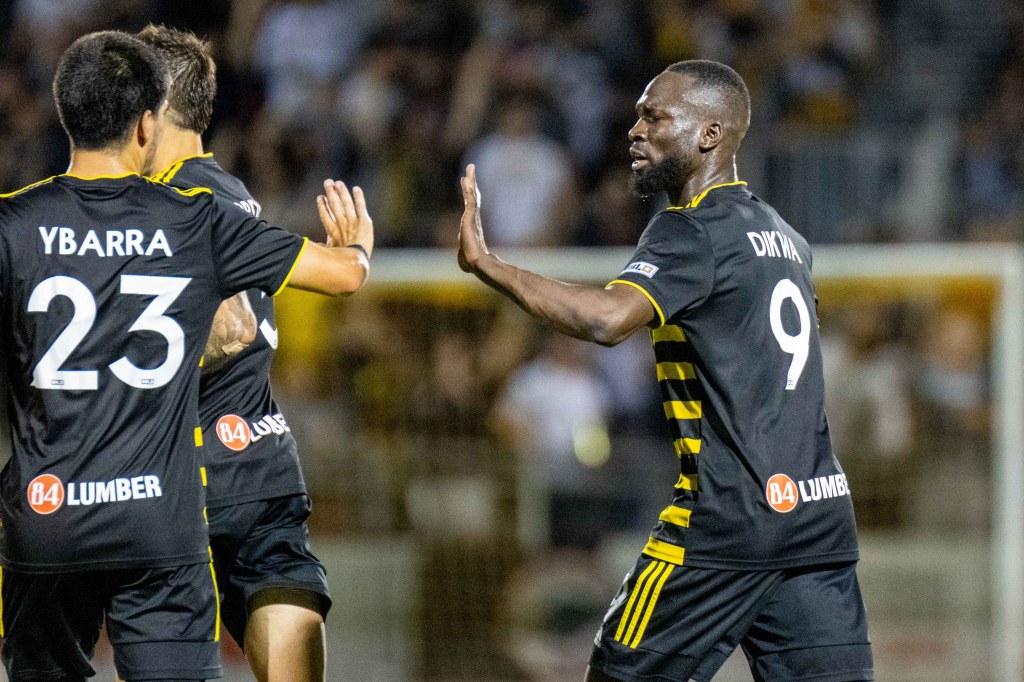 Albert Dikwa gives a high five to Marc Ybarra after scoring in the Pittsburgh Riverhounds' 3-2 win over FC Tulsa on Sept. 30, 2023 at Highmark Stadium.