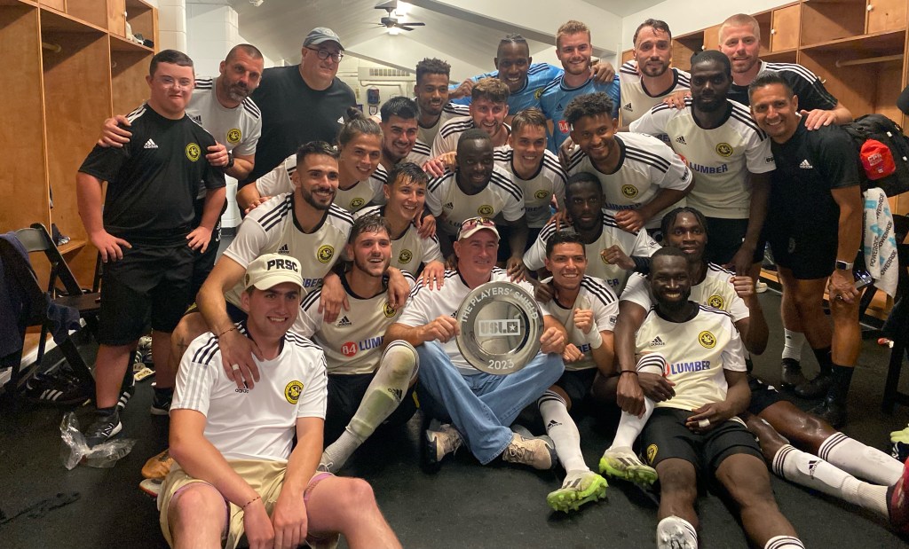 The Riverhounds celebrate with the USL Championship Players' Shield after winning 2-0 against the Tampa Bay Rowdies at Al Lang Stadium in St. Petersburg, Fla. on Oct. 7, 2023.