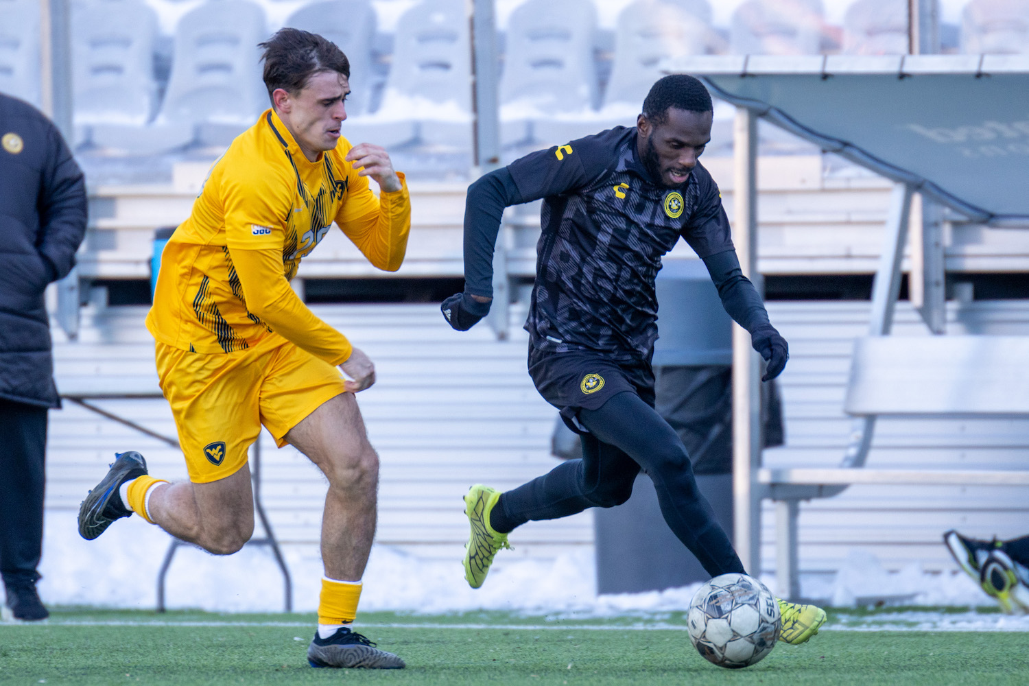 Junior Etou dribbles down the left wing for the Riverhounds in a preseason match against West Virginia University.