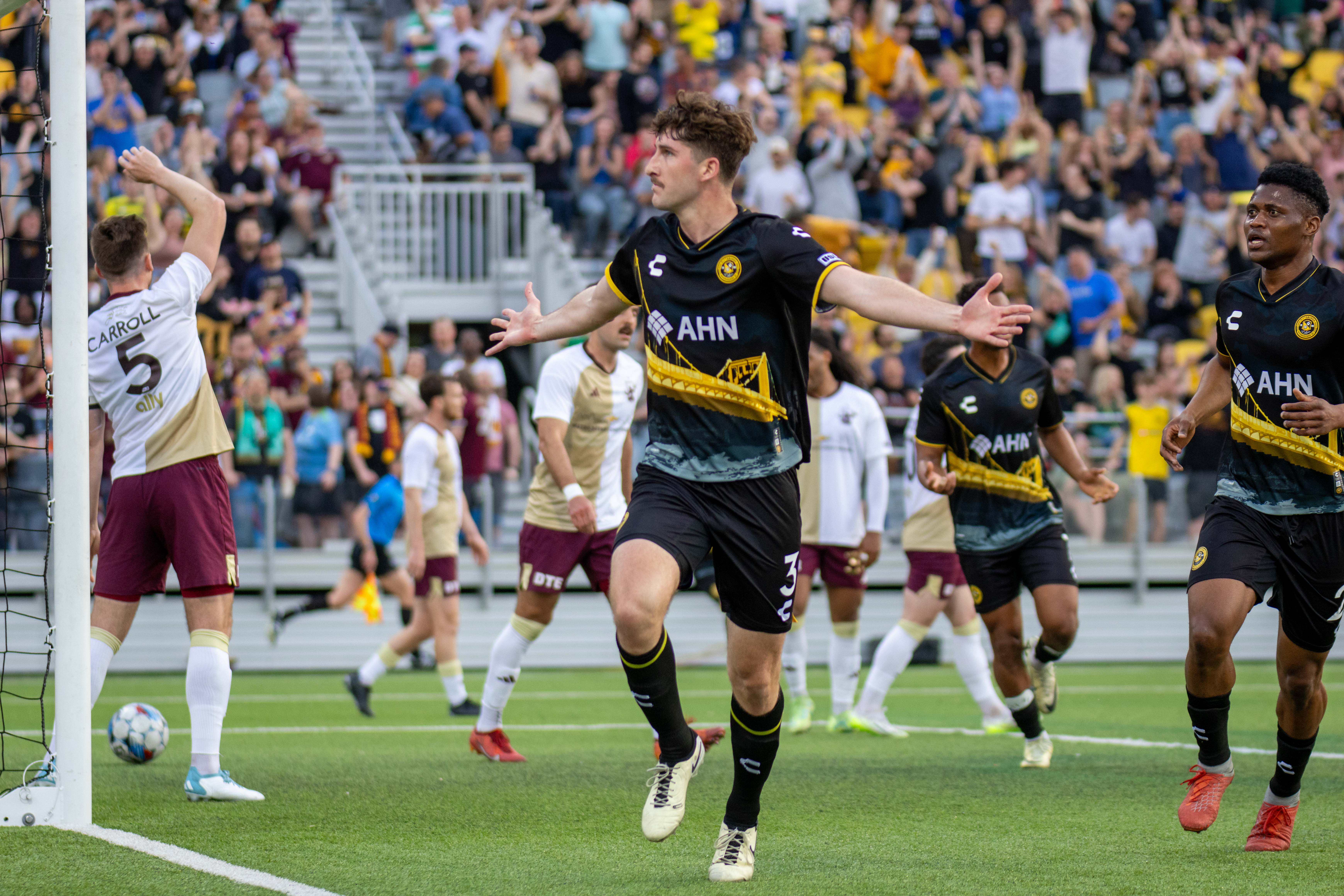 Pat Hogan celebrates his opening goal in the Riverhounds' 2-0 win over Detroit City FC on April 27, 2024, at Highmark Stadium. (Photo: Chris Cowger/Riverhounds SC)