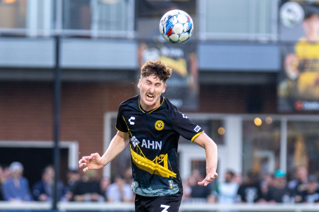 Hounds center back Pat Hogan heads the ball clear in the team's 2-0 win over Detroit City FC on April 27, 2024 at Highmark Stadium.