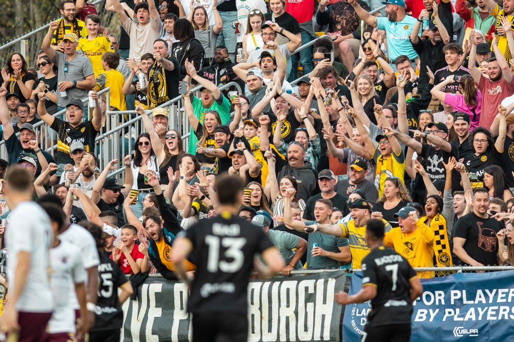 Fans celebrate after the Hounds' opening goal in their 2-0 win over Detroit City FC on April 27, 2024 at Highmark Stadium.