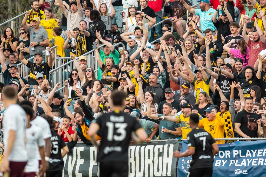 Fans celebrate after the Hounds' opening goal in their 2-0 win over Detroit City FC on April 27, 2024 at Highmark Stadium.