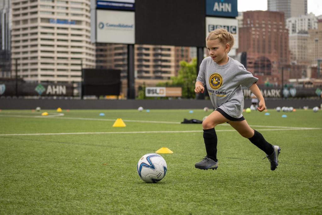 Players participating in a Pittsburgh Riverhounds summer soccer camp