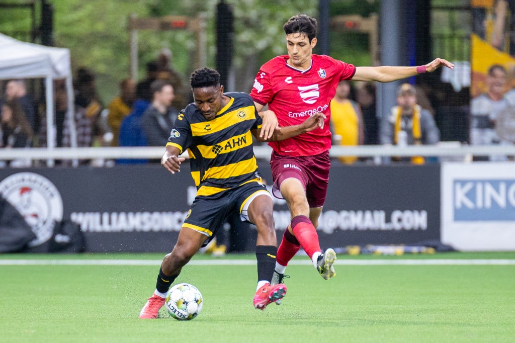 Riverhounds defender Perrin Barnes holds off North Carolina FC's Pedro Dolabella during the teams' match on May 3, 2025 at Highmark Stadium. (Photo: Chris Cowger/Riverhounds SC)