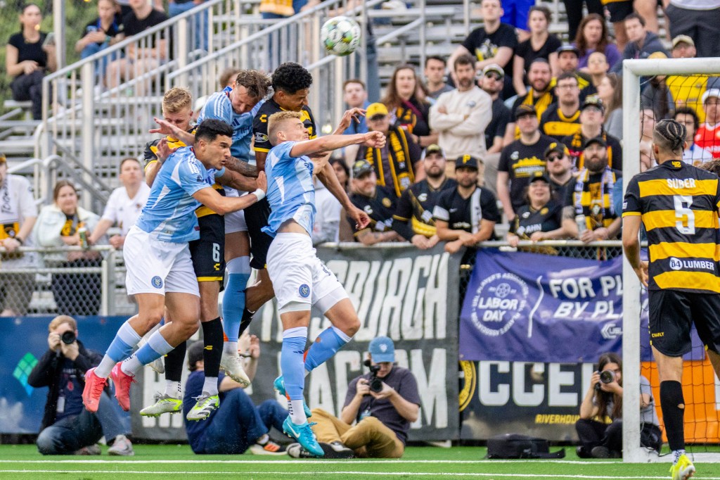 A crowd of players rise to win a free kick served into the box during the Pittsburgh Riverhound's 1-0 win the U.S. Open Cup over New York City FC on May 7, 2025 at Highmark Stadium in Pittsburgh. (Photo: Chris Cowger/Riverhounds SC)