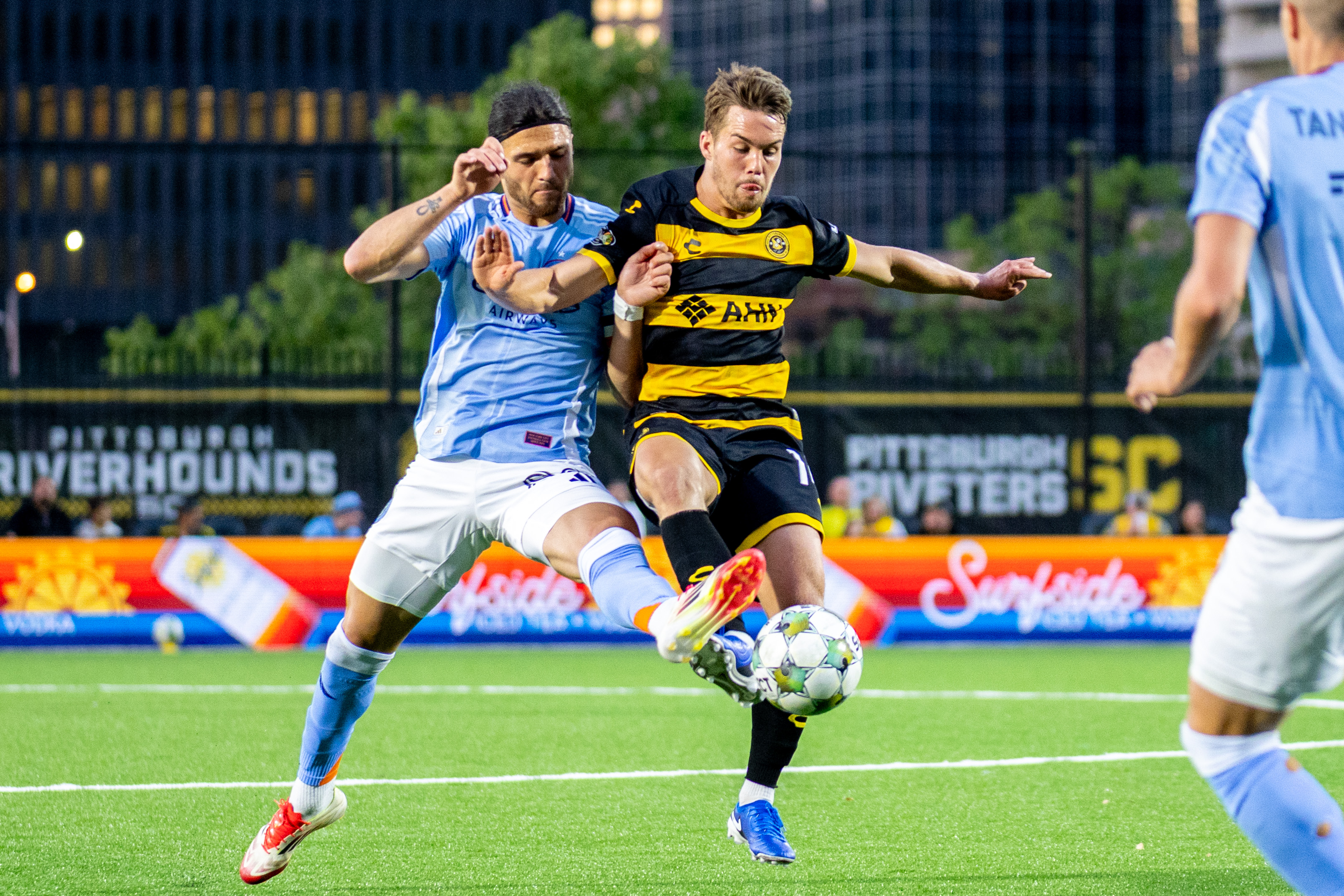 Robbie Mertz battles New York City FC's Justin Haak for the ball in the Riverhounds' 1-0 U.S. Open Cup win May 7, 2025 at Highmark Stadium in Pittsburgh. (Photo: Chris Cowger/Riverhounds SC)