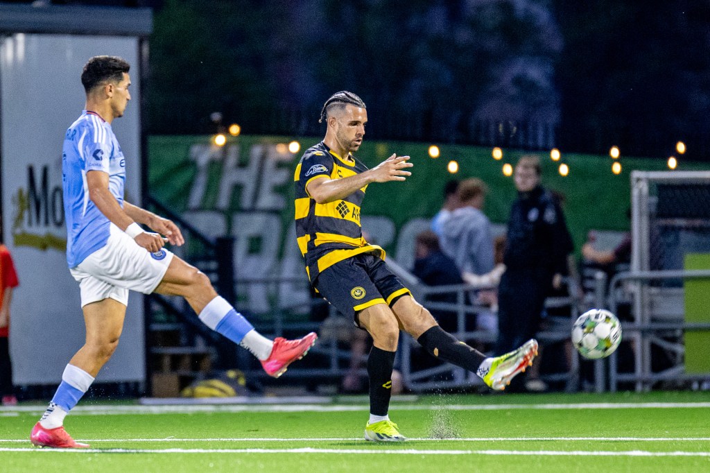 Sean Suber distributes the ball during the Riverhounds' 1-0 U.S. Open Cup win over New York City FC on May 7, 2025 at Highmark Stadium. (Photo: Chris Cowger/Riverhounds SC)