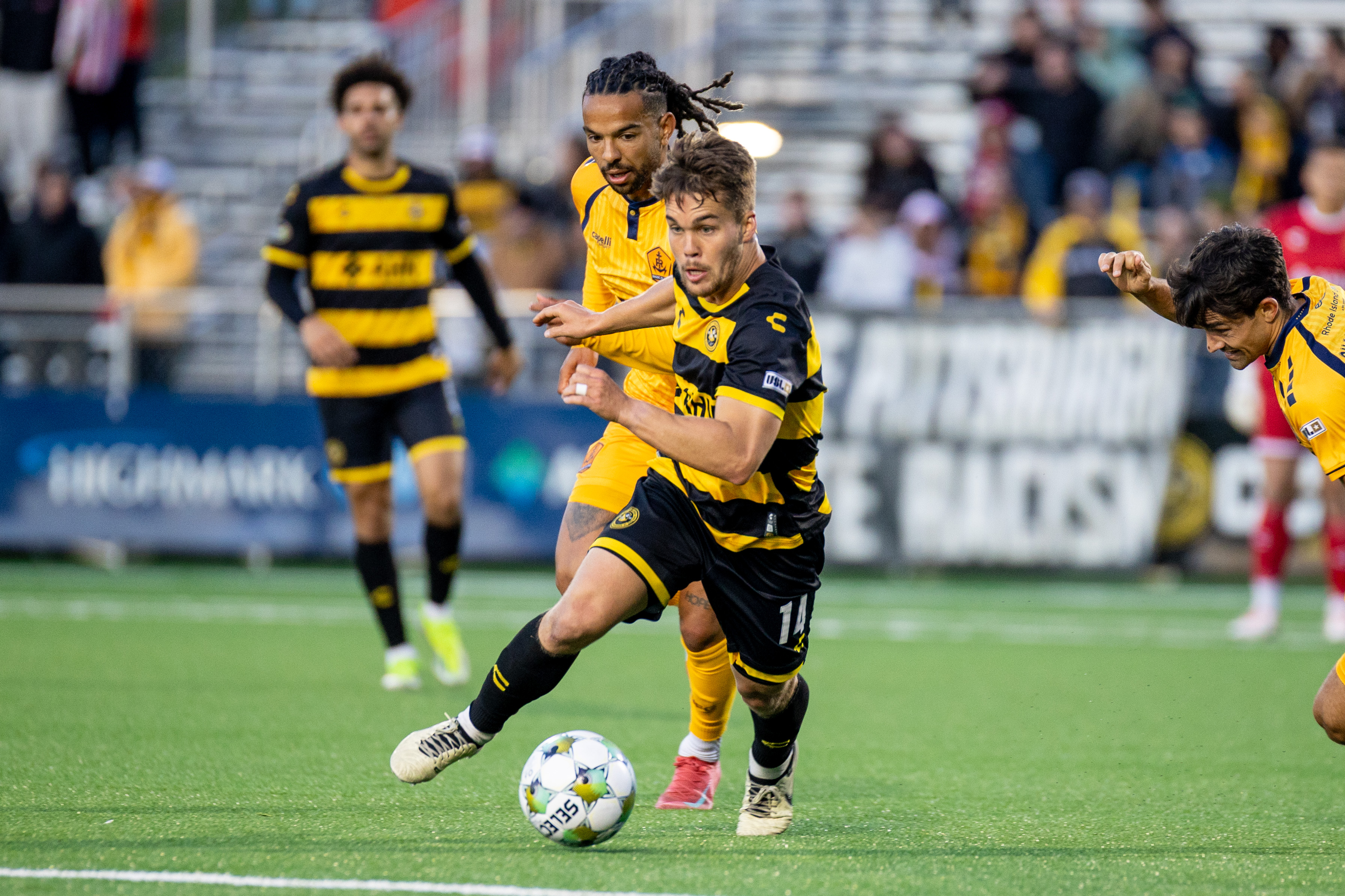 Pittsburgh Riverhounds midfielder Robbie Mertz evades Rhode Island FC's Noah Fuson in the team's USL Jägermeister Cup match May 31, 2025 at Highmark Stadium in Pittsburgh. (Photo: Chris Cowger/Riverhounds SC)