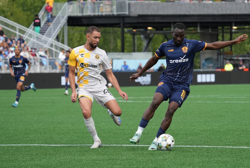 Pittsburgh Riverhounds center back Guillaume Vacter cuts off Rhode Island FC striker Albert Dikwa in the Hounds' 1-0 win May 24, 2025 at Centreville Bank Stadium in Pawtucket, R.I. (Photo: Rhode Island FC)