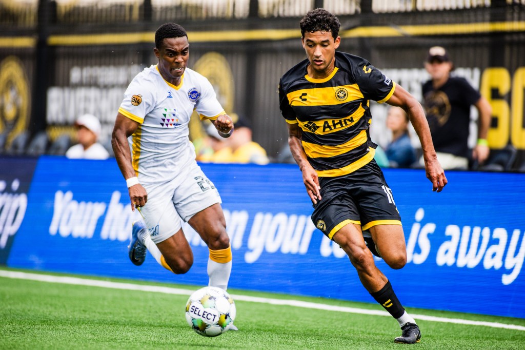 Bertin Jacquesson, the match's lone goal scorer, turns the corner around Westchester SC's Stephen Payne in the Pittsburgh Riverhounds' 1-0 win June 28, 2025 at Highmark Stadium in Pittsburgh. (Photo: Ryan Shaffer/Riverhounds SC)