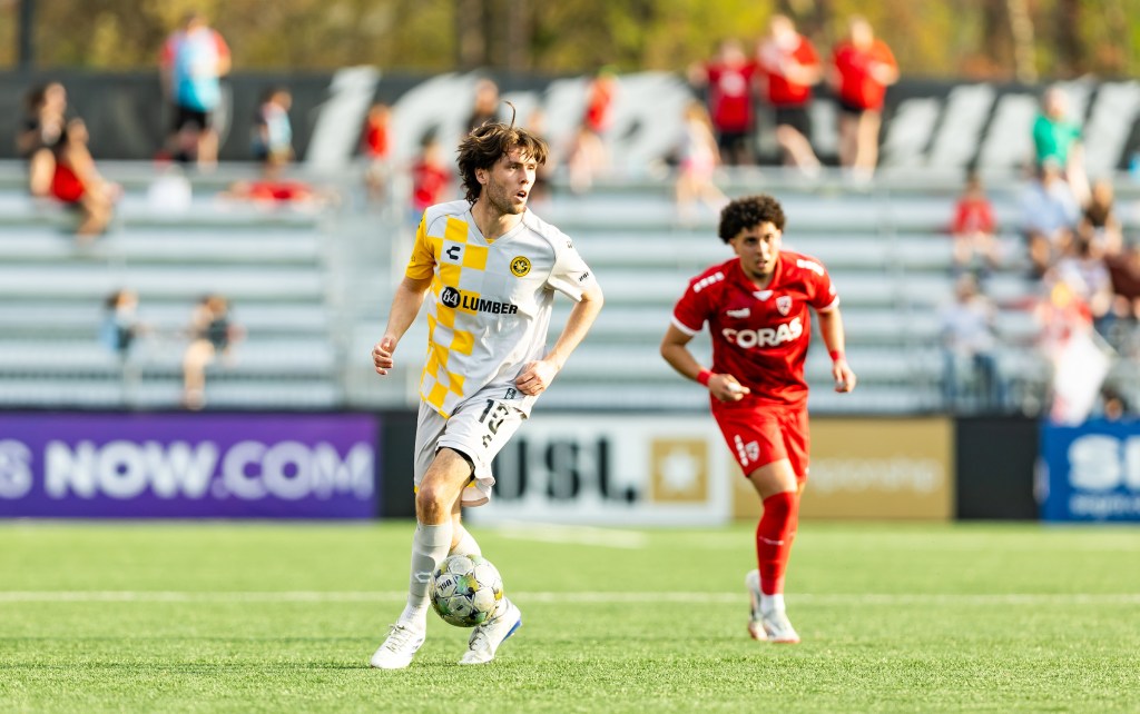 Pittsburgh Riverhounds midfielder Bradley Sample looks upfield in the team's match against Loudoun United FC on April 19, 2025 at Segra Field in Leesburg, Va. (Photo: Mallory Neil/Riverhounds SC)