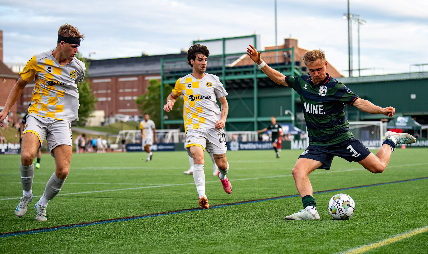 Pittsburgh Riverhounds Max Broughton (left) and Jason Bouregy converge on Portland Hearts of Pine's Nathan Messer in the teams' USL Jägermeister Cup match on July 25, 2025 at Fitzpatrick Stadium in Portland, Maine. (Photo: Cullen McIntyre/Hearts of Pine SC)