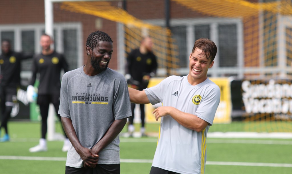 Kenardo Forbes and Robbie Mertz laugh during a 2020 Pittsburgh Riverhounds training session at Highmark Stadium in Pittsburgh. (Photo: Justin McCauley/Riverhounds SC)