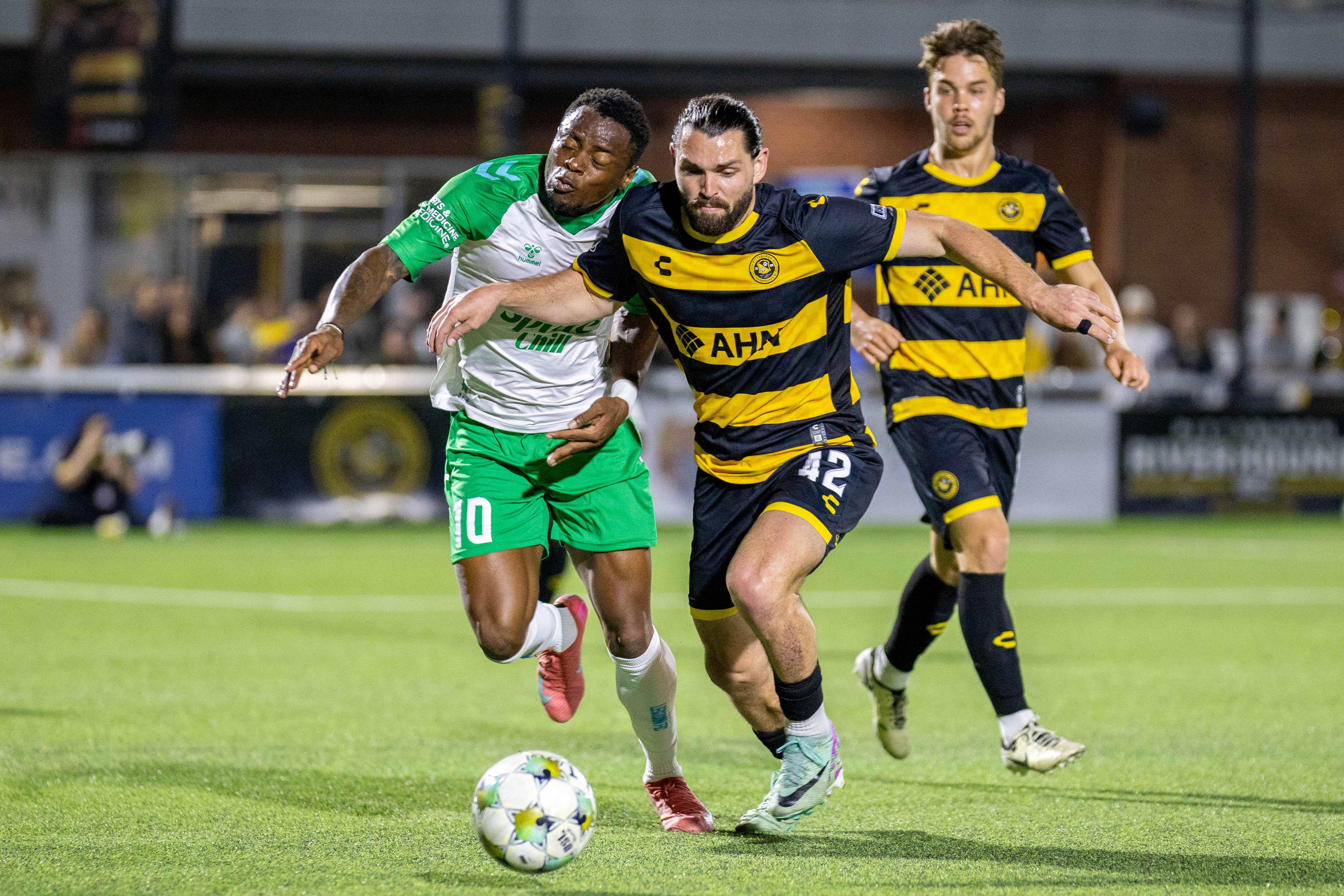 Pittsburgh Riverhounds midfielder Jackson Walti nudges past Birmingham Legion forward Tabort Etaka Preston to win the ball in the Hounds' 2-0 win on March 29, 2025 at Highmark Stadium in Pittsburgh. (Photo: Chris Cowger/Riverhounds SC)