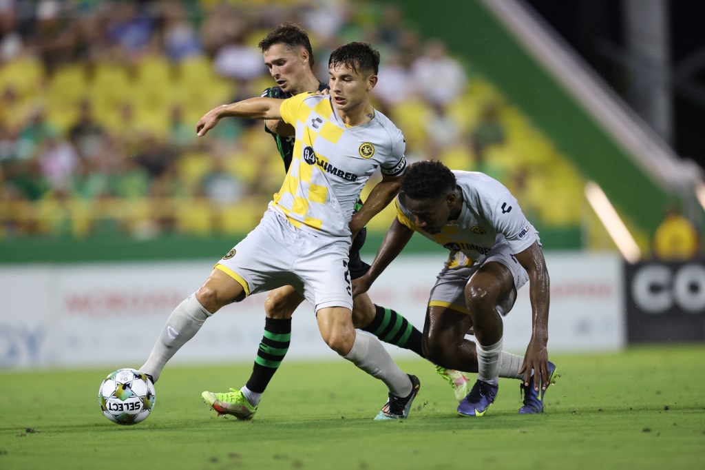 Danny Griffin wins the ball for the Pittsburgh Riverhounds in front of teammate Perrin Barnes and the Tampa Bay Rowdies' Paul Marie in their match Aug. 30, 2025 at Al Lang Stadium in St. Petersburg, Fla. (Photo: Tampa Bay Rowdies)