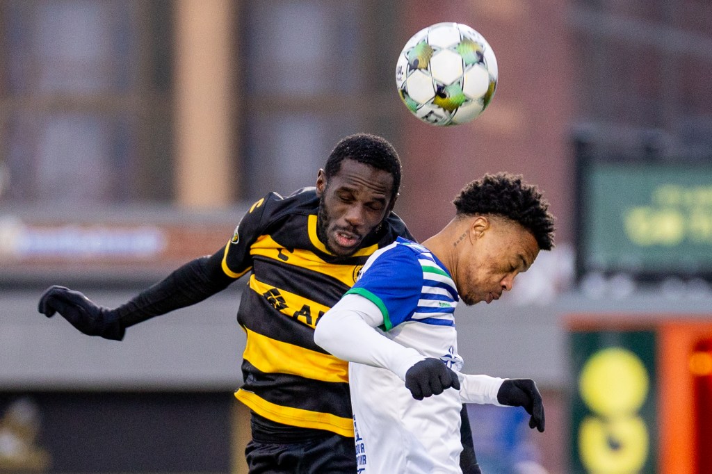 Junior Etou rises to win a header over Hartford Athletic's Deshane Beckford in the Pittsburgh Riverhounds' 1-0 win on March 22, 2025 at Highmark Stadium in Pittsburgh. (Photo: Chris Cowger/Riverhounds SC)