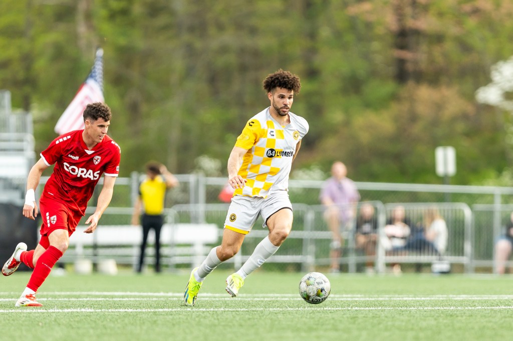 Pittsburgh Riverhounds center back Sean Suber dribbles the ball in the team's match against Loudoun United FC on April 19, 2025 at Segra Field in Leesburg, Va. (Photo: Mallory Neil/Riverhounds SC)