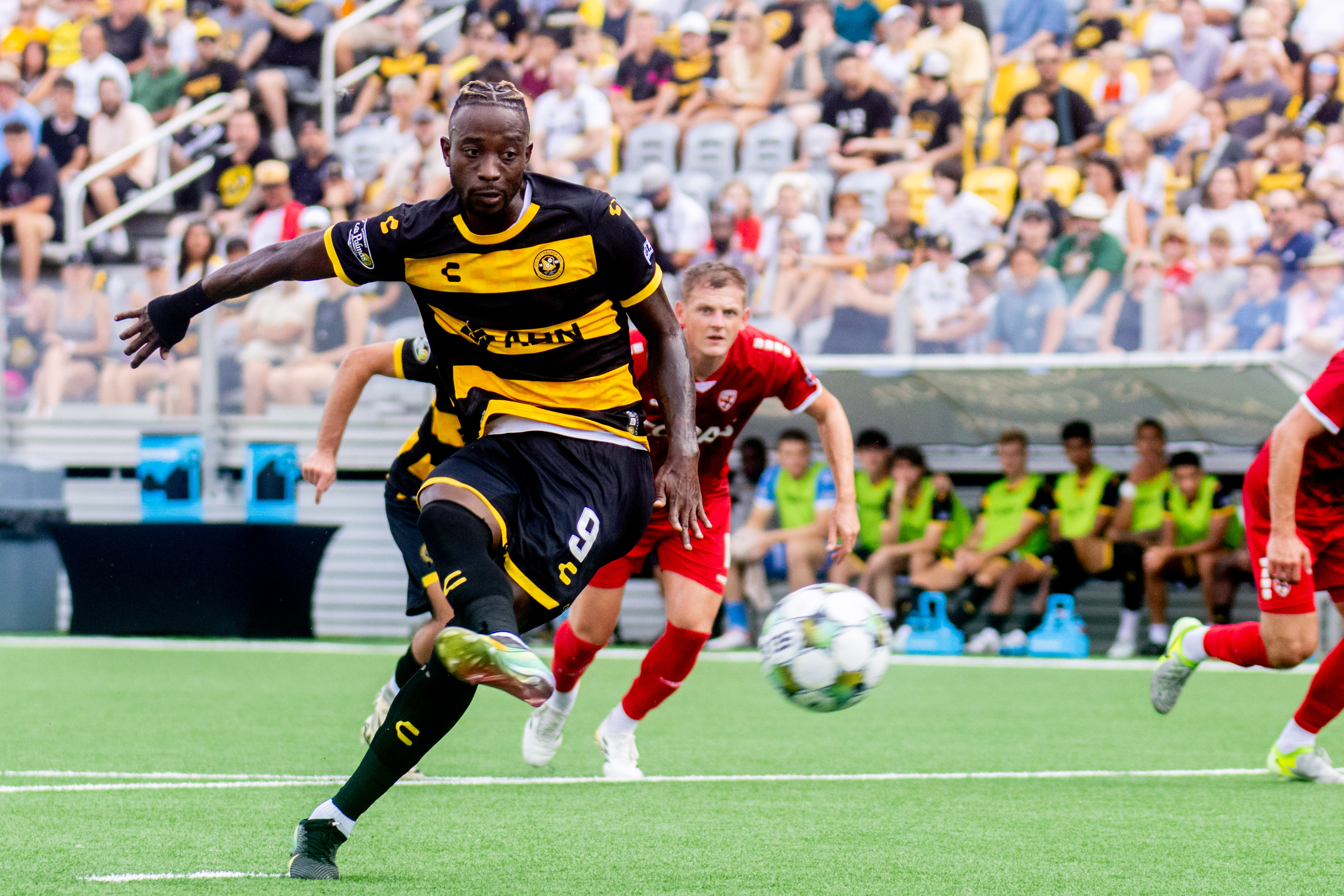 Pittsburgh Riverhounds striker Augi Williams scores on a penalty kick in the Hounds' match against Loudoun United FC on July 13, 2025 at Highmark Stadium. (Photo: Chris Cowger/Riverhounds SC)