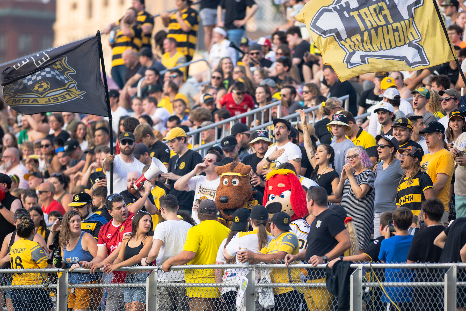 Fans cheer — with AMO front and center — in the Paul Child Stand during the Pittsburgh Riverhounds match against Orange County SC on Aug. 9, 2025 at Highmark Stadium in Pittsburgh. (Photo: Ryan Shaffer/Riverhounds SC)