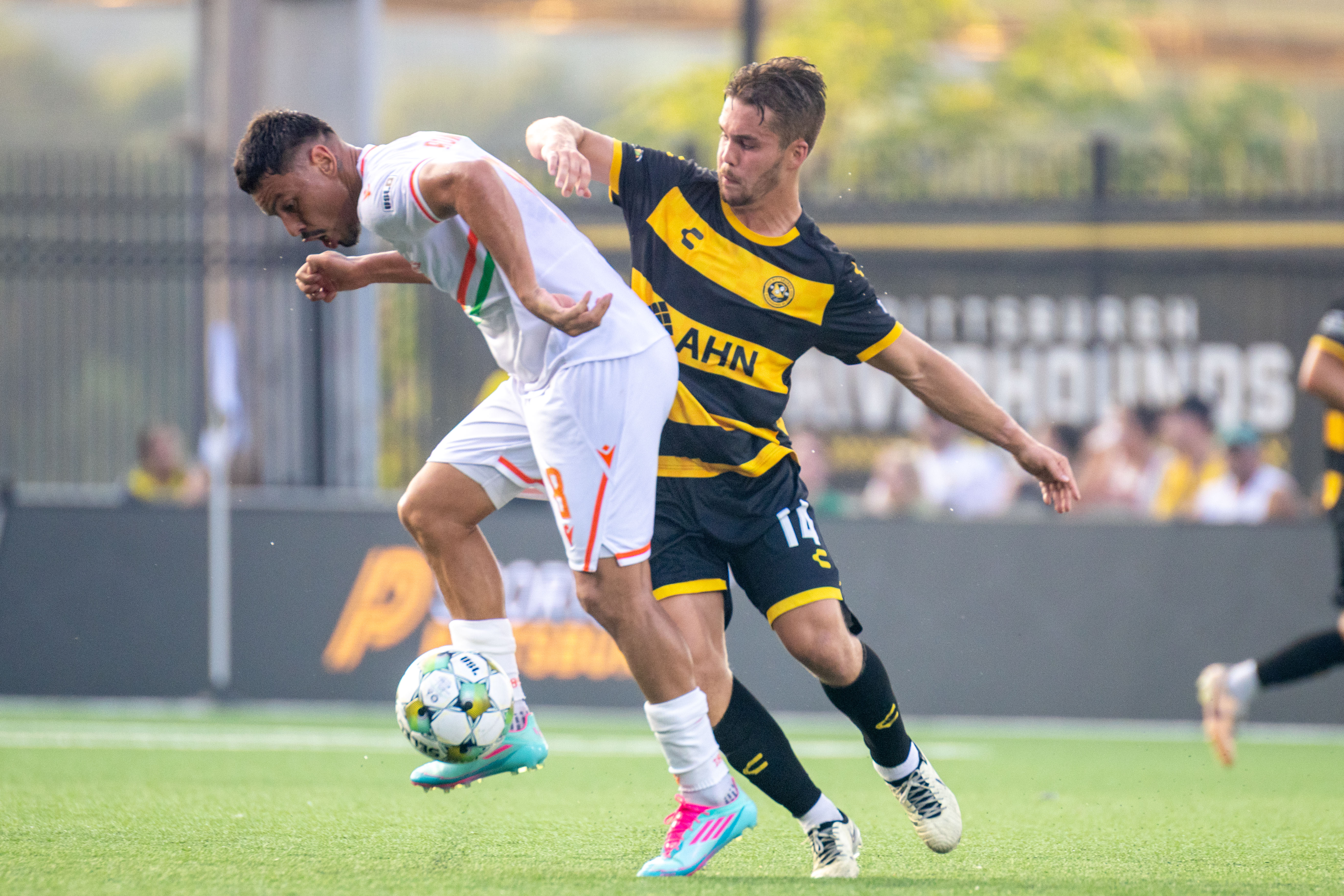 Pittsburgh Riverhounds SC's Robbie Mertz (right) battles for the ball with Miami FC's Matías Romero in the teams' match July 29, 2025 at Highmark Stadium in Pittsburgh. (Photo: Chris Cowger/Riverhounds SC)
