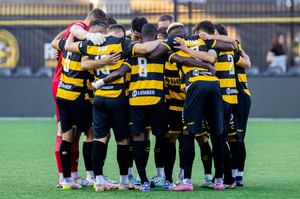 Pittsburgh Riverhounds players huddle before the start of their 1-0 win over Las Vegas Lights FC on Sept. 28, 2025 at Highmark Stadium in Pittsburgh. (Photo: Chris Cowger/Riverhounds SC)