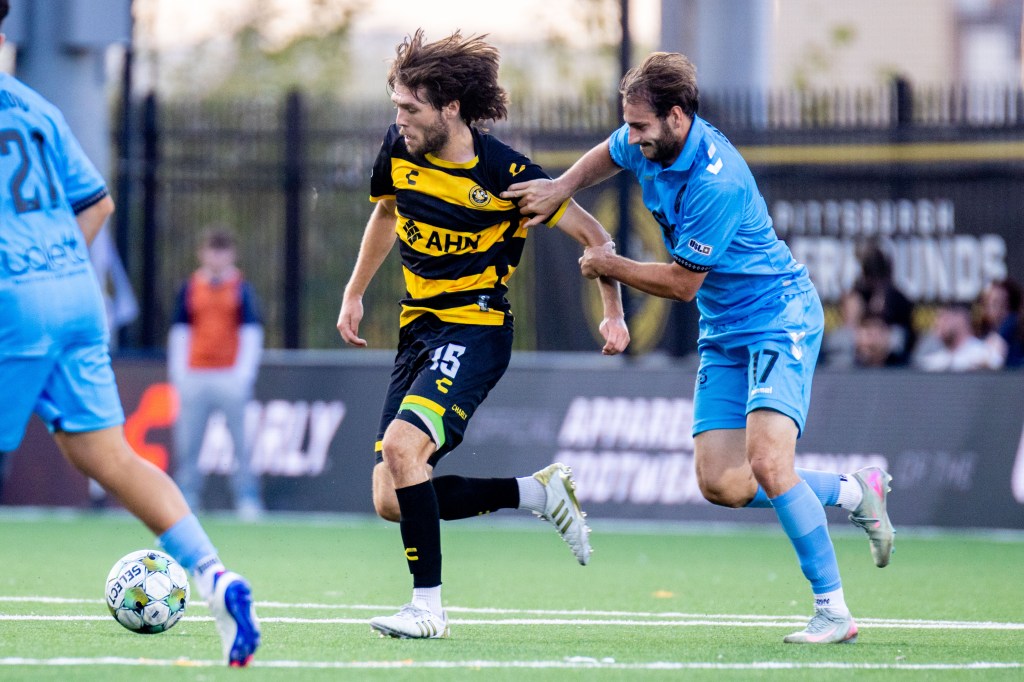 Bradley Sample dribbles away from Las Vegas Lights FC's Patrick Leal in the Pittsburgh Riverhounds' 1-0 win Sept. 28, 2025 at Highmark Stadium in Pittsburgh. (Photo: Chris Cowger/Riverhounds SC)