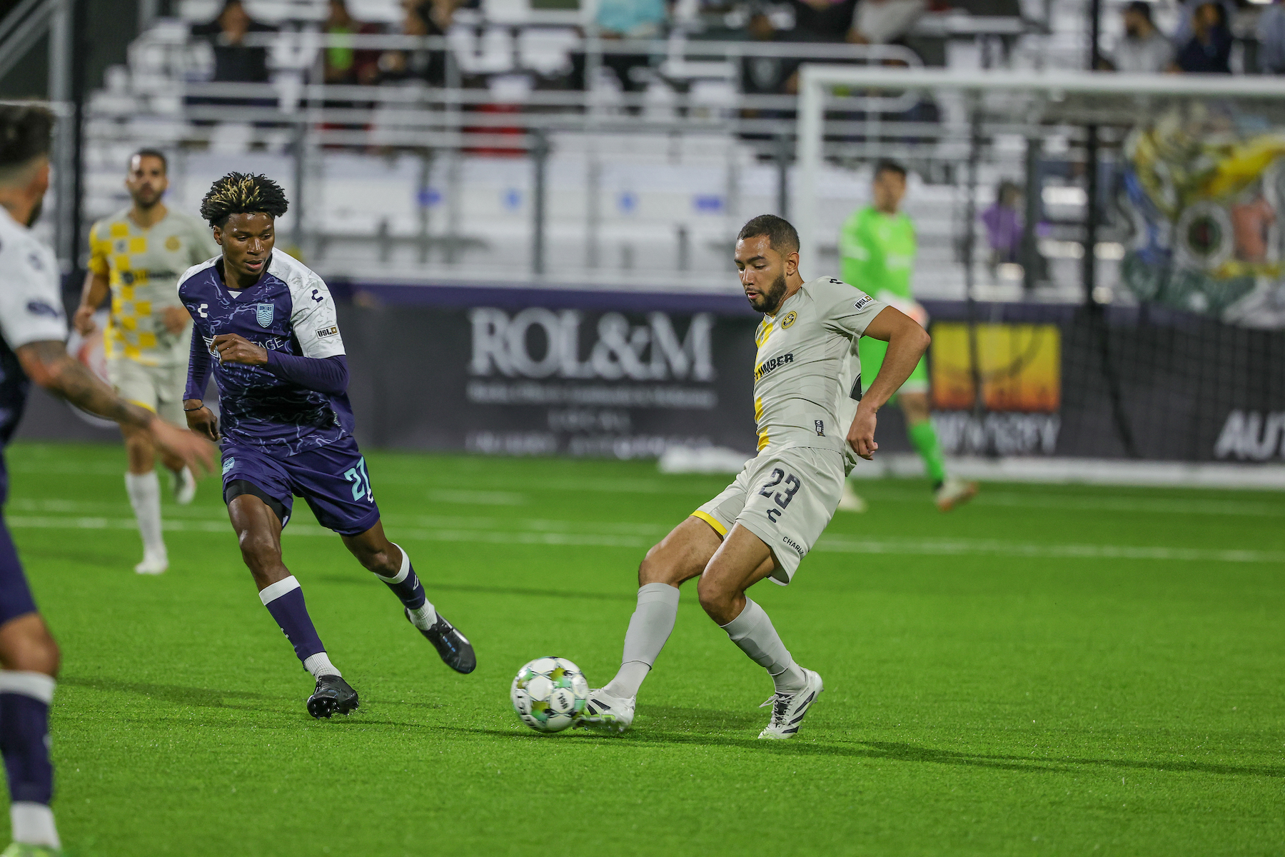 Guillaume Vacter plays a pass in front of Monterey Bay FC's Tarik Scott in the Pittsburgh Riverhounds' 3-0 win on Oct. 18, 2025 at Cardinale Stadium in Seaside, Calif. (Photo: Monterey Bay FC)