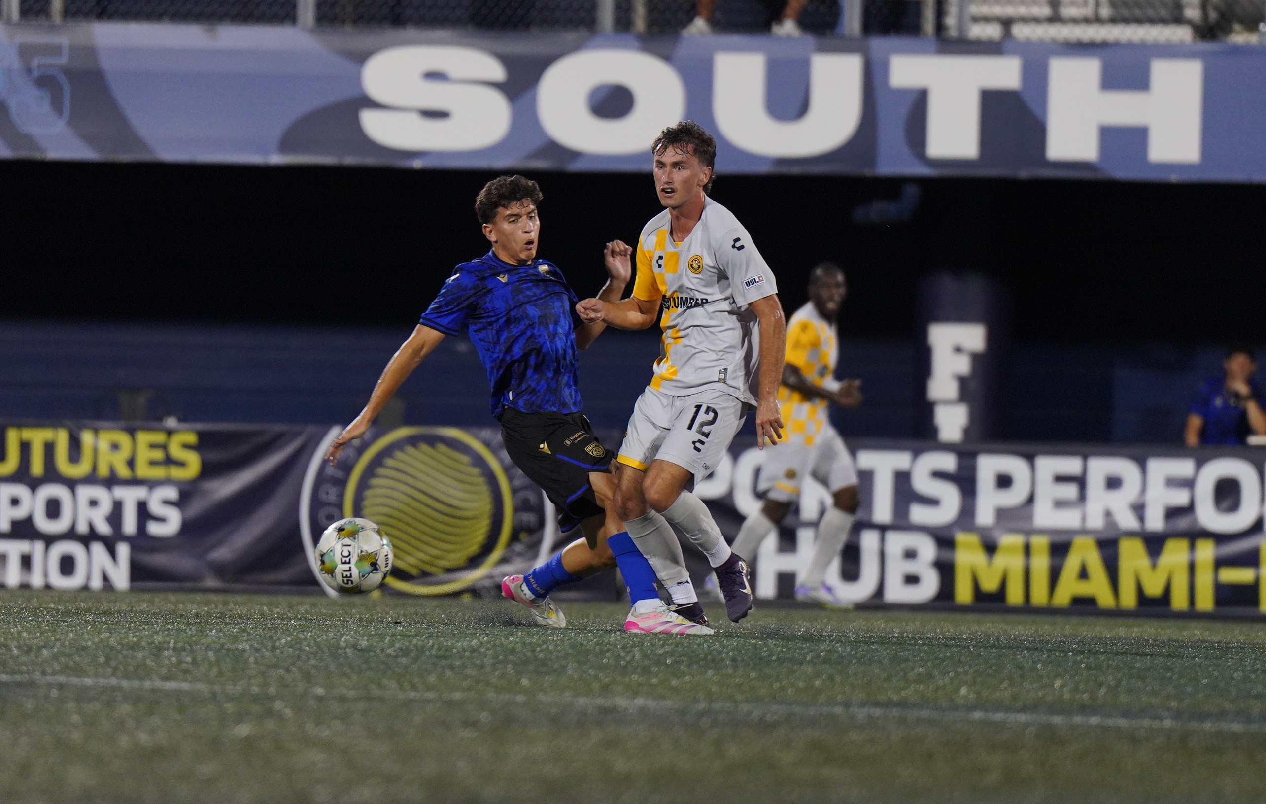 Charles Ahl moves the ball past Miami FC's Cristian Vazquez in the Pittsburgh Riverhounds' match Oct. 4, 2025 at Pitbull Stadium in Miami. (Photo: Miami FC)