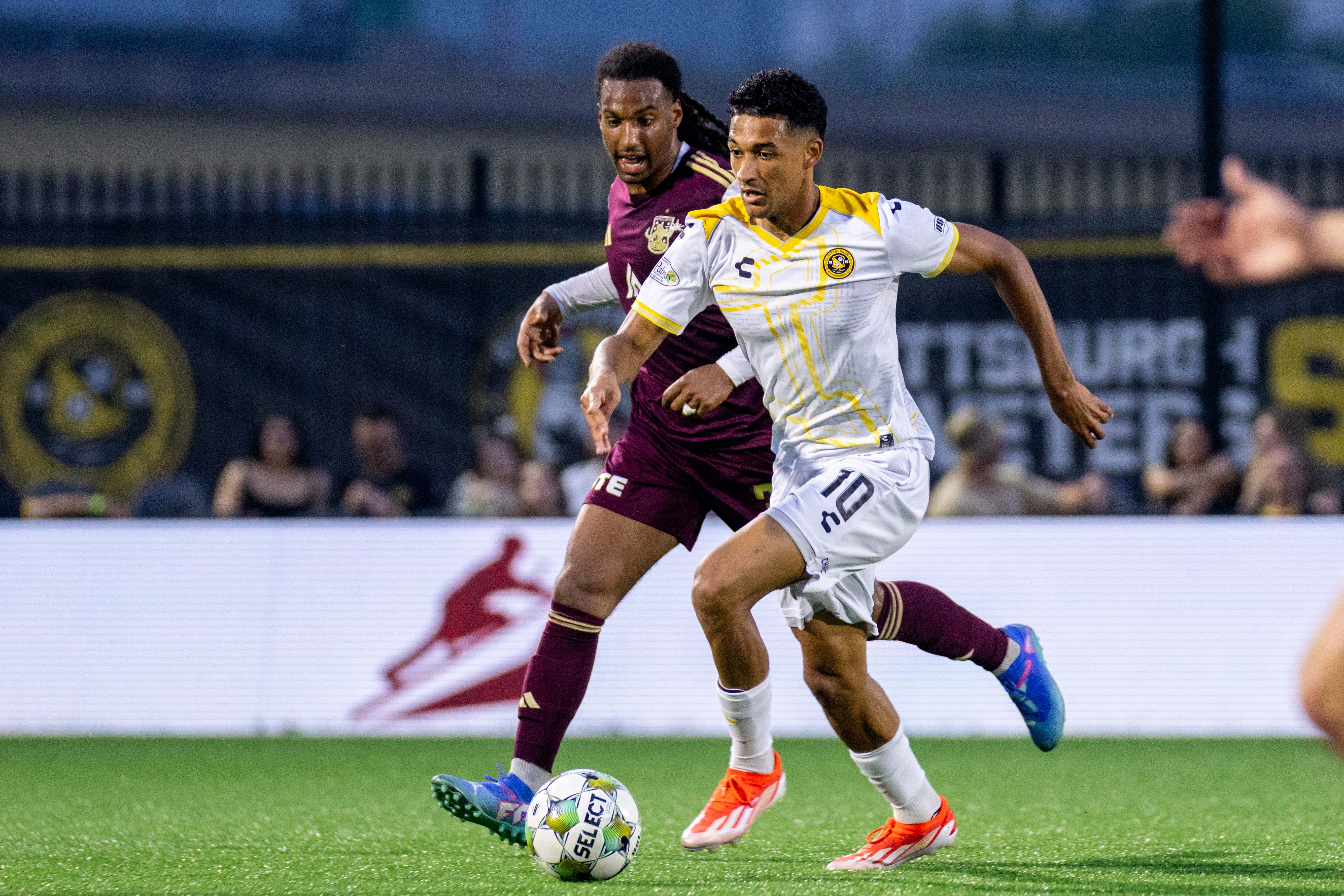Pittsburgh Riverhounds forward Bertin Jacquesson dribbles away from the Detroit City FC defense in the Hounds' 2-0 win on June 7, 2025 at Highmark Stadium in Pittsburgh. (Photo: Chris Cowger/Riverhounds SC)