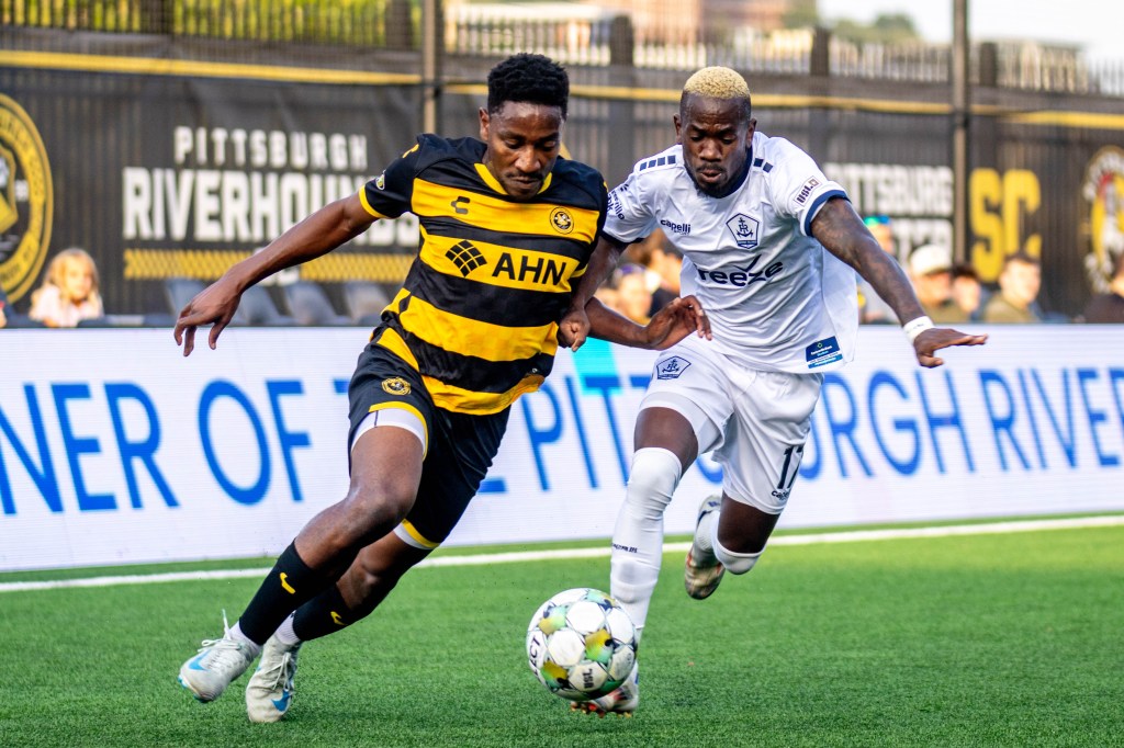 Perrin Barnes turns the corner around Rhode Island FC's Jojea Kwizera in the Pittsburgh Riverhounds' 2-0 win on Aug. 2, 2025 at Highmark Stadium in Pittsburgh. (Photo: Chris Cowger/Riverhounds SC)