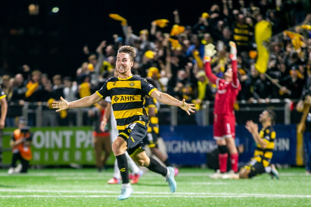 Robbie Mertz leads the celebrations after the final whistle of the Pittsburgh Riverhounds' 1-0 win over Rhode Island FC in the USL Championship Eastern Conference Final on Nov. 15, 2025 at Highmark Stadium in Pittsburgh. (Photo: Chris Cowger/Riverhounds SC)