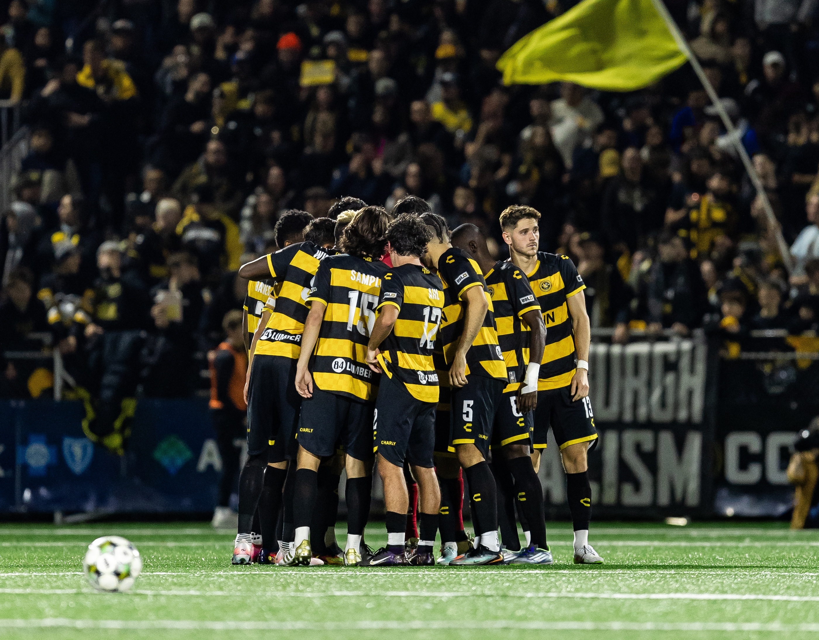 Pittsburgh Riverhounds players huddle before the start of the second half of their Eastern Conference Final victory over Rhode Island FC on Nov. 15, 2025 at Highmark Stadium in Pittsburgh. (Photo: Mallory Neil/Riverhounds SC)