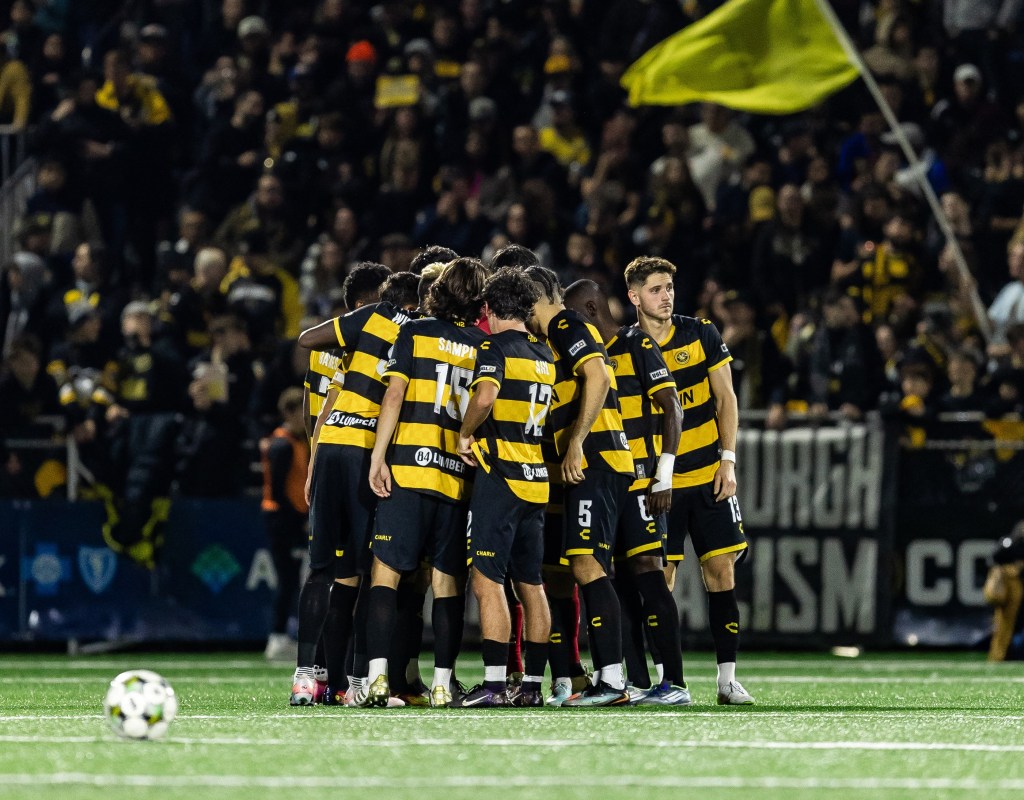 Pittsburgh Riverhounds players huddle before the start of the second half of their Eastern Conference Final victory over Rhode Island FC on Nov. 15, 2025 at Highmark Stadium in Pittsburgh. (Photo: Mallory Neil/Riverhounds SC)